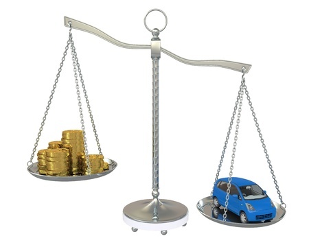 a-scale-weighing-coins-and-a-car