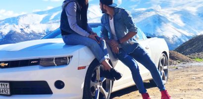 Couple Near White Chevrolet Coupe