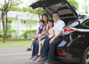 Family sitting in vehicle