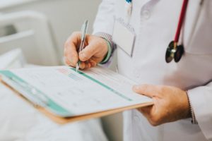 Doctor with stethoscope and clipboard