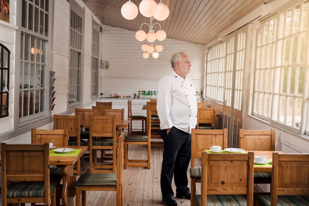 restaurant owner stands in empty restaurant