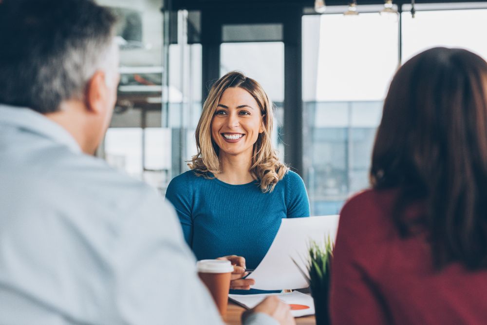 insurance broker reviews policy with couple