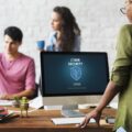 lady looking at computer showing a cyber security confirmation page