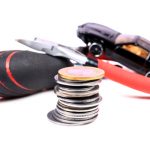 stack-of-coins-tools-and-a-toy-car