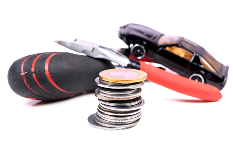 stack-of-coins-tools-and-a-toy-car