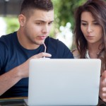 Couple-comparing-insurance-rates-on-a-laptop