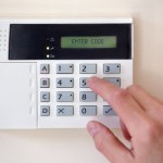 Security-alarm-keypad-with-person-arming-the-system