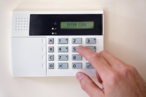 Security alarm keypad with person arming the system