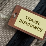 Travel-insurance-tag-tied-to-a-luggage